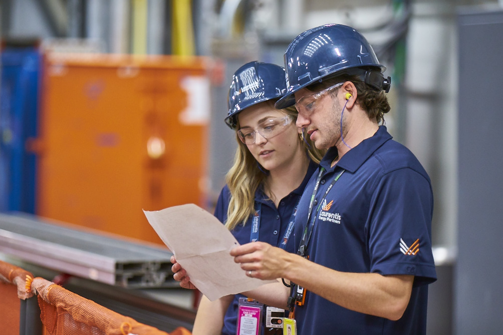 Workers harvesting isotopes with the Target Delivery System.